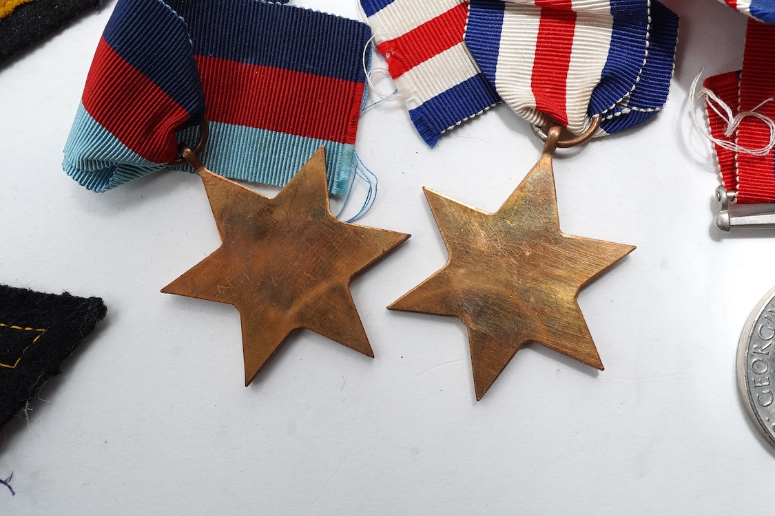 A First World War Mons Star trio awarded to Capt. A.D. Lowdell, with a clasp for 5th Aug-22nd Nov 1914, and oakleaf - mention in dispatches, together with the miniature set, plus a WWII Defence medal in its original card